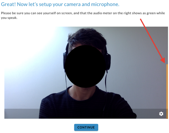 The camera and microphone setup screen with a camera preview, an arrow pointing to the audio meter and a Continue button