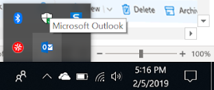 The Windows hidden icons tray open, with a Microsoft Outlook tooltip over the Outlook icon